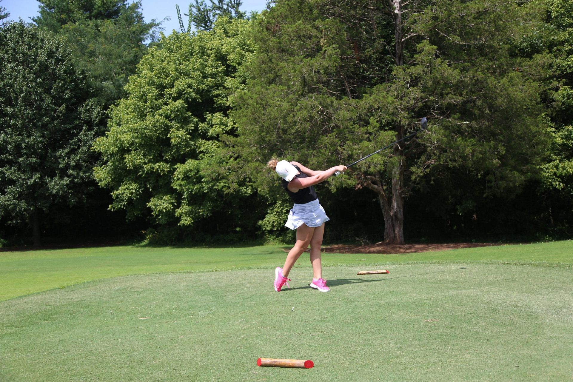 Lily Hyams driving on the golf course